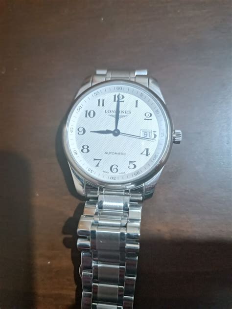 how to spot a fake longines conquest watch